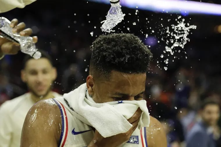 Markelle Fultz gets doused with water by his teammates after recording his first career triple-double Wednesday night.