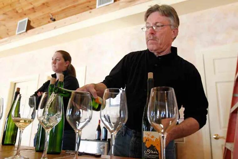 Rich Blair, the winemaker at Blair Winery, pours his 2012 Gewurtztraminer for a tasting.  ( MICHAEL BRYANT / Staff Photographer )