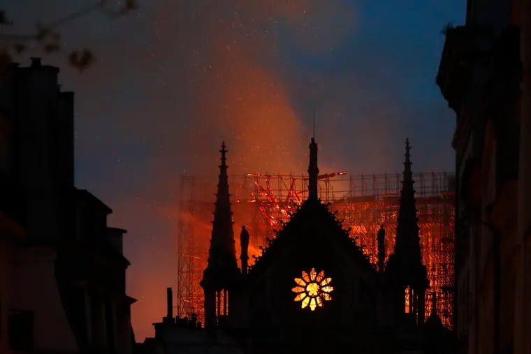 Flames and smoke rise from Notre Dame cathedral as it burns in Paris, Monday, April 15, 2019.