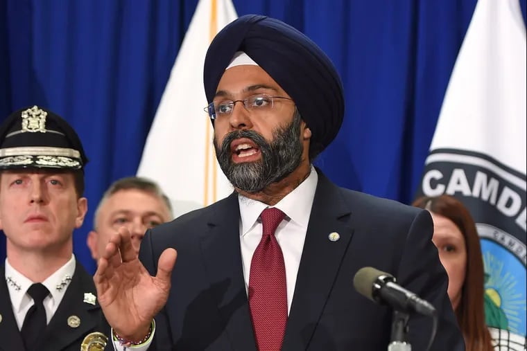 New Jersey Attorney General Gurbir Grewal center) is among a group of top prosecutors nationwide to launch their own investigations into allegations of Catholic clergy sexual abuse. TOM GRALISH / Staff Photographer