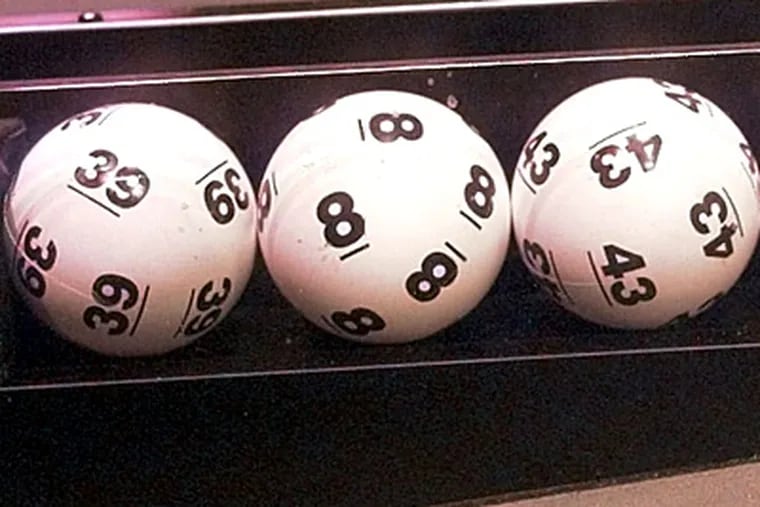 Tonight's Powerball jackpot has grown to $222 million. (Steve Pope / AP File Photo)