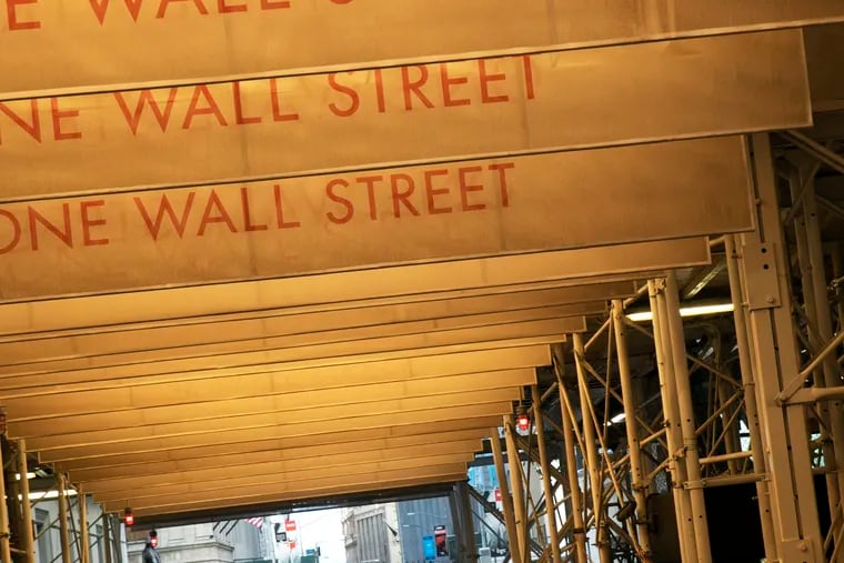 Construction scaffolding covers a portion of Wall Street next to the New York Stock Exchange on June 16, 2020. Stocks have been a bright spot amid the pandemic. But Congress needs to act quickly to keep the recovery going. (AP Photo/Mark Lennihan)