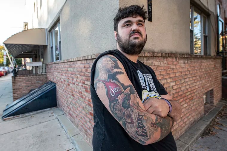 Dillon Schmanek is photographed near his home in South Philadelphia. Dillon is a diehard Sixers fan who got a full Ben Simmons tattoo back when "the process" was looking good. He stands by it, even with Simmons' fall from grace.