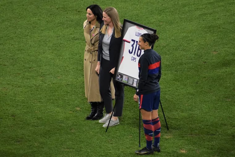 U.S. women's soccer team general manager Kate Markgraf (left) with president Cindy Cone (center) and Carli Lloyd (right) at Lloyd's national team farewell in late 2021. Markgraf will report to U.S. Soccer CEO JT Batson following Earnie Stewart's departure.