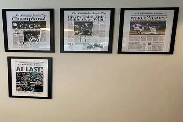 Wall of Inquirer Sports pages from Philadelphia championships, in Neil Vogel's home.