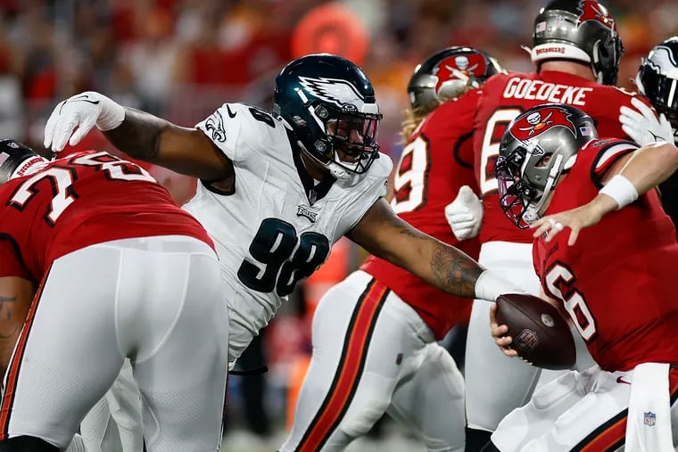 Eagles defensive tackle Jalen Carter goes after Tampa Bay Buccaneers quarterback Baker Mayfield on Monday. In front of friends and family in his home state, the rookie forced two fumbles.