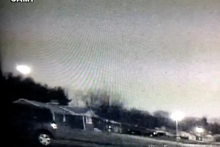 This is a still from video of the meteor captured by a home security camera in Thurmont, Md. The meteor can be seen at far left as it flashes across the Maryland skies. (Credit: Kim Fox via YouTube)