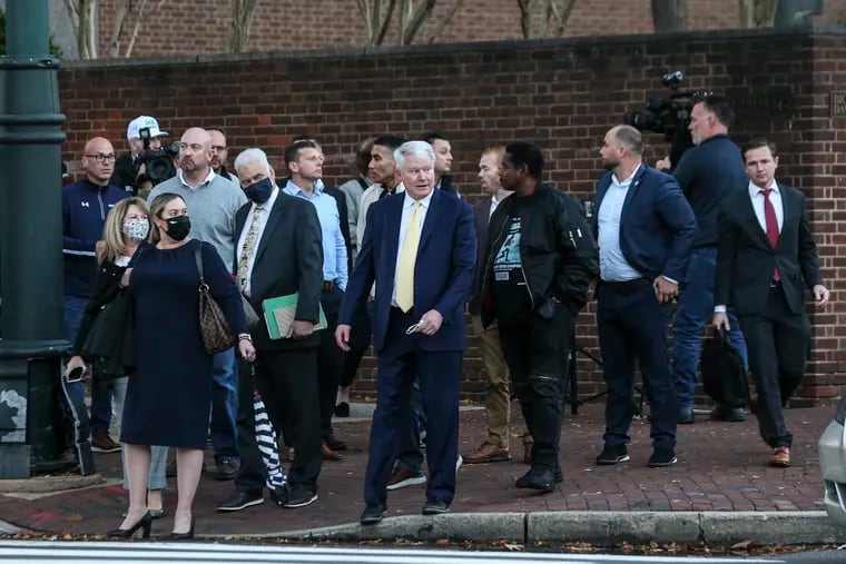 Labor leader John Dougherty, center, leaves the federal courthouse in Center City surrounded by family and supporters on Friday after the jury in his federal bribery case failed to reach a verdict in a third day of deliberations.