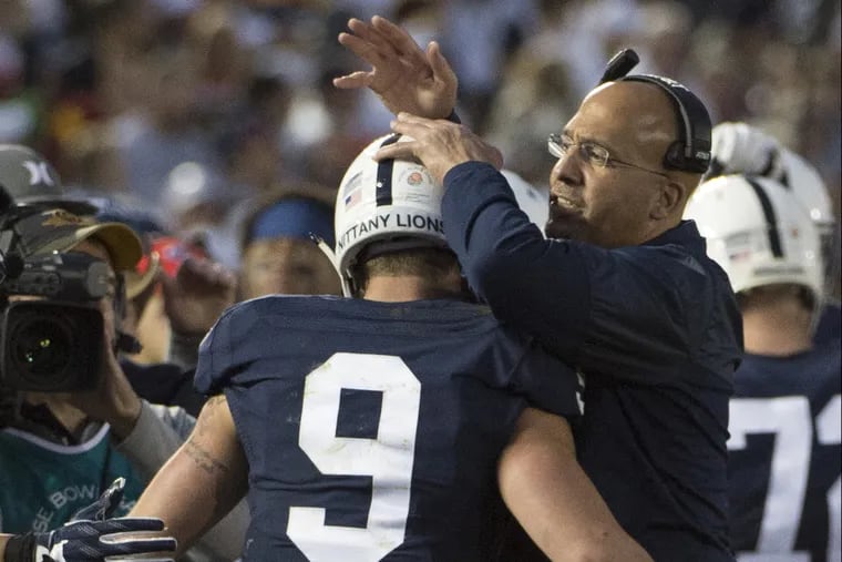 Penn State head coach James Franklin congratulates quarterback Trace McSorley after he scored a touchdown in the 3rd quarter of the 103rd Rose Bowl Game January 2, 2017. USC beat Penn State 52-49 on a last second field goal.