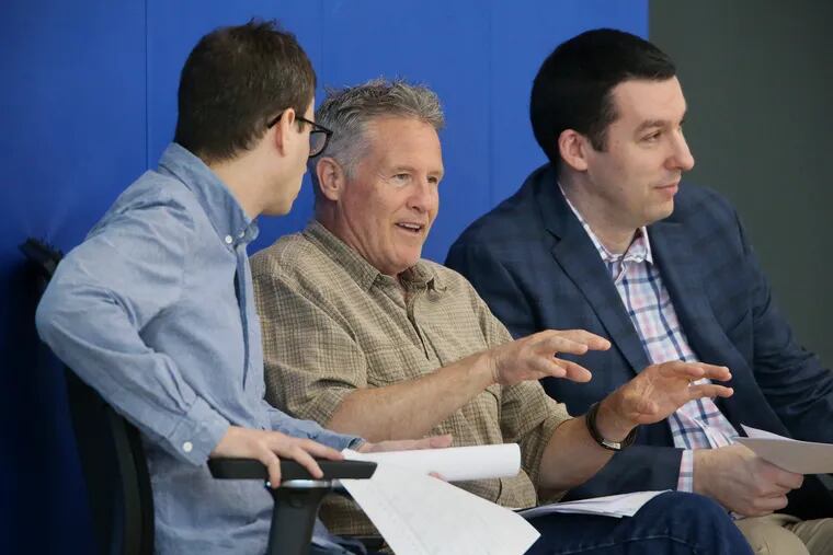 Sixers assistant general manager Ned Cohen, former coach Brett Brown and Alex Rucker watching prospects during a pre-draft workout in June.
