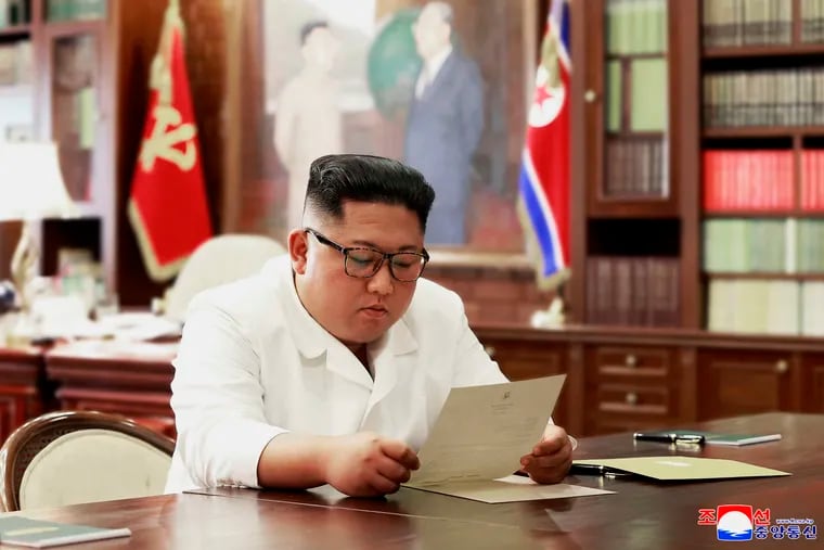 In this undated photo provided on Sunday, June 23, 2019, by the North Korean government, North Korean leader Kim Jong Un reads a letter from U.S. President Donald Trump. Independent journalists were not given access to cover the event depicted in this image distributed by the North Korean government. The content of this image is as provided and cannot be independently verified. Korean language watermark on image as provided by source reads: "KCNA" which is the abbreviation for Korean Central News Agency.