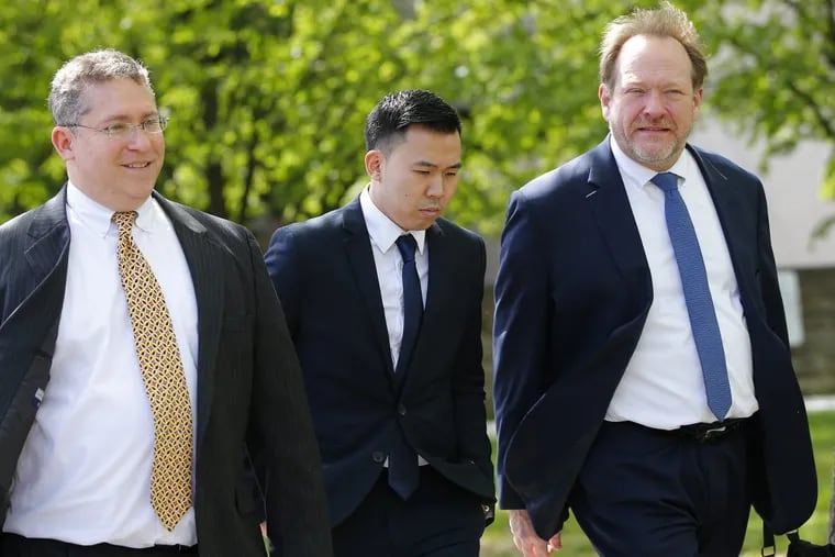 In this May 15, 2017, file photo, Kenny Kwan, center, leaves the Monroe County Courthouse in Stroudsburg. Kwan is one of four New York City men from the New York City who pleaded guilty to involuntary manslaughter in the 2013 death of a fraternity pledge from the Baruch College campus of the City University of New York  at a rented house in the Poconos.  (AP Photo/Rich Schultz, File)