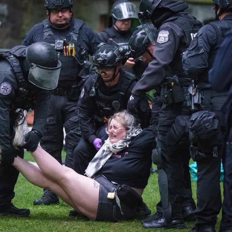 Police arrest a protester on the University of Pennsylvania campus, in Philadelphia, 10 May 2024