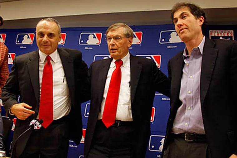 Bud Selig (center) added to his legacy as commissioner with a relatively easy CBA negotiation. (Bebeto Matthews/AP)