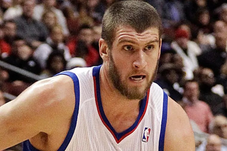 Spencer Hawes left Saturday's game in the third quarter when he experienced a mid-back strain. (Matt Slocum/AP)