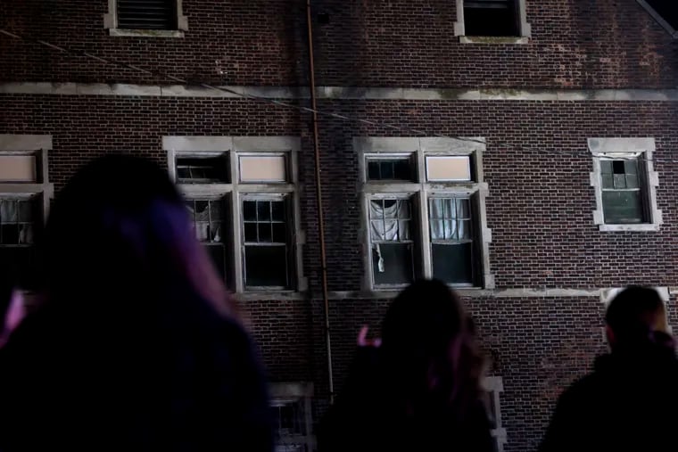 Broken windows at the historic Pennhurst State School make for a scary entrance to the Pennhurst Asylum haunted house attraction in Spring City, Pa. on Friday, October 21, 2022.