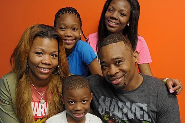 Fidel Napier with wife Kiyonna and children Taliah (back left), Teyonna, and Fidel Jr. He may be deported to his native Jamaica. CLEM MURRAY / Staff Photographer