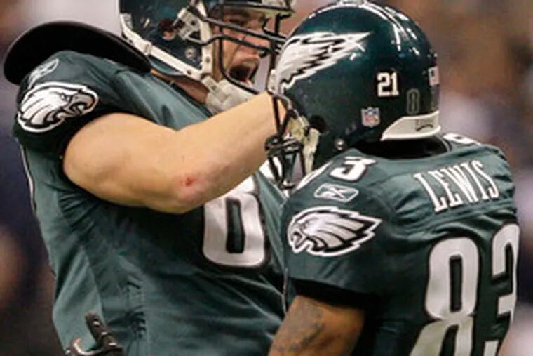 Eagles tight end Brent Celek, above, and receiver Greg Lewis get happy after Celek&#0039;s key 29-yard catch for a first down late in the fourth quarter. Below, safety Brian Dawkins disputes a call.