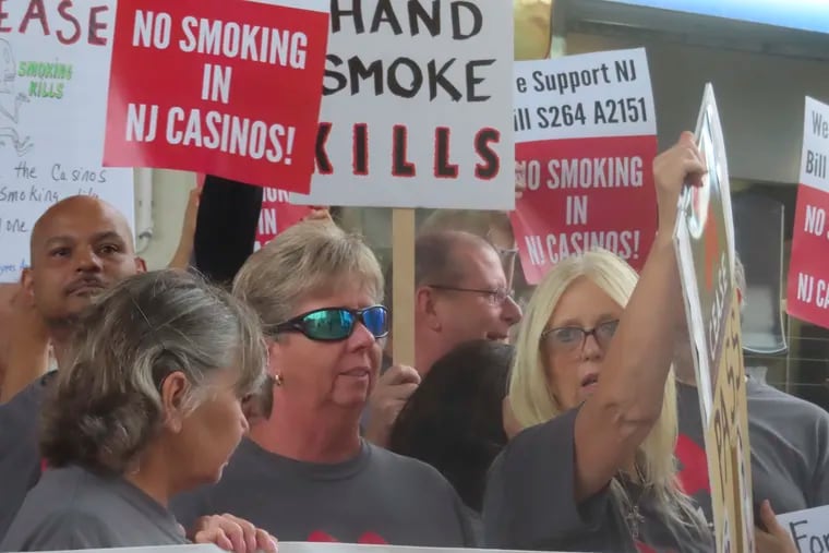 Casino workers and patrons opposed to smoking in the gambling halls demonstrate outside the Hard Rock casino in Atlantic City in September 2022.