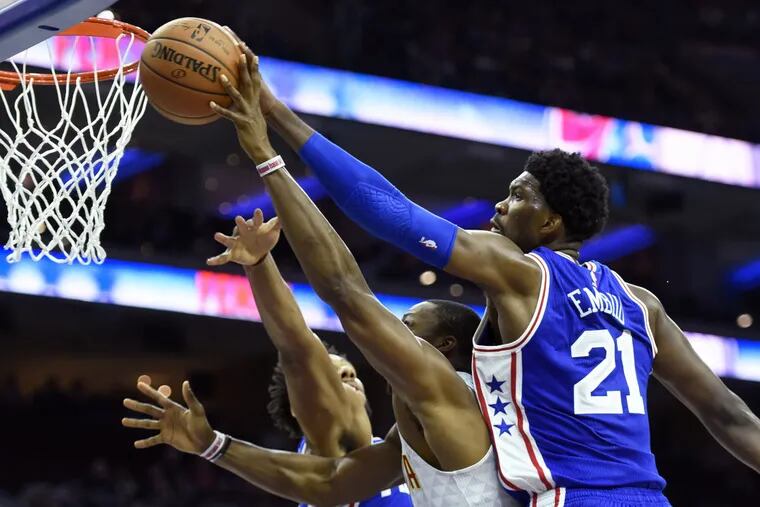 The sky's the limit for Joel Embiid, blocking a shot by Atlanta's Dwight Howard.
