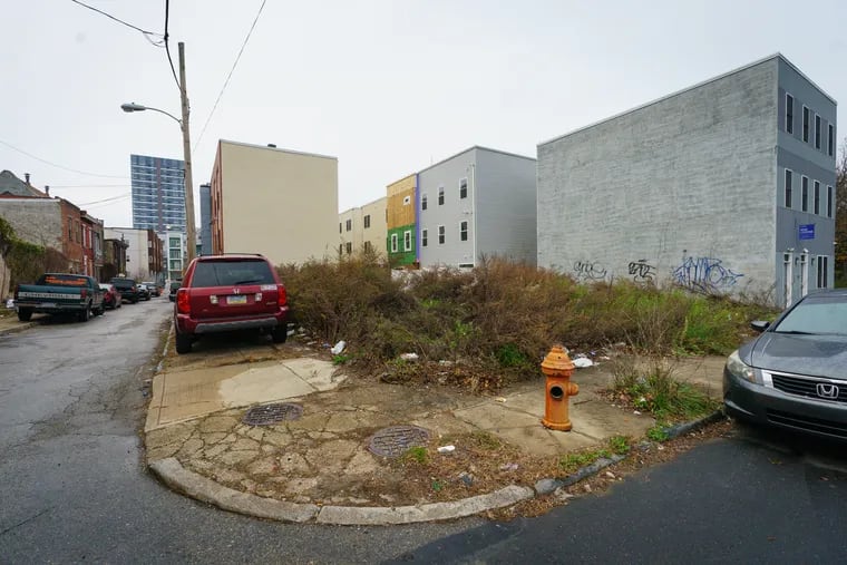 An assemblage of empty lots at the corner of 16th and Ingersoll Streets, where developer Chris Rahn agreed five years ago to build affordable housing in a deal with the Philadelphia Housing Development Corp.