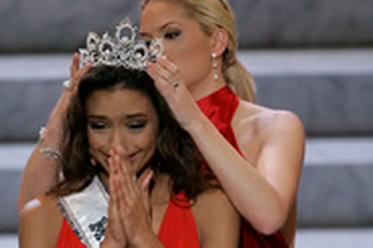 Rachel Smith, 21, of Clarksville, Tenn., is crowned Miss USA by her predecessor, Tara Conner, whose reign was marked by scandal.