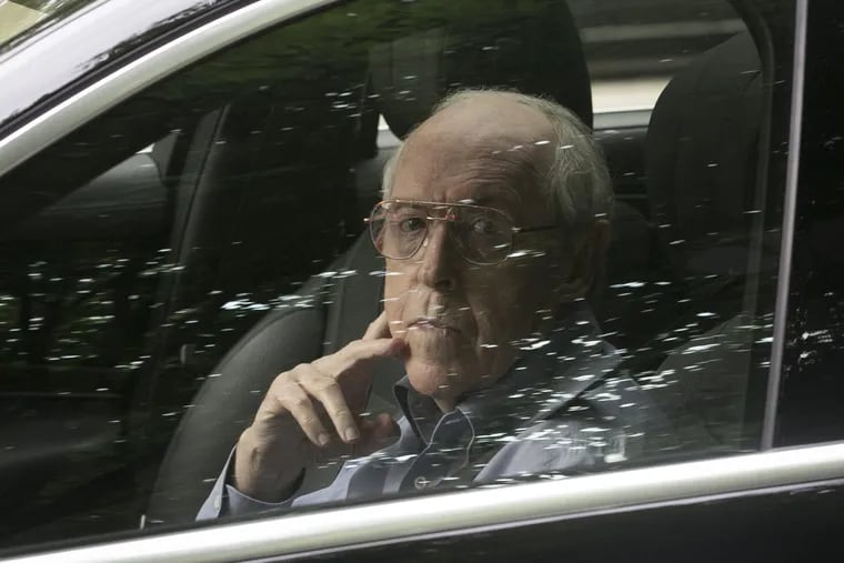 Main Line payday lending pioneer Charles Hallinan, peers through reflections on his closed car window after he was sentenced Friday to 14 years in federal prison for his conviction on racketeering conspiracy charges.