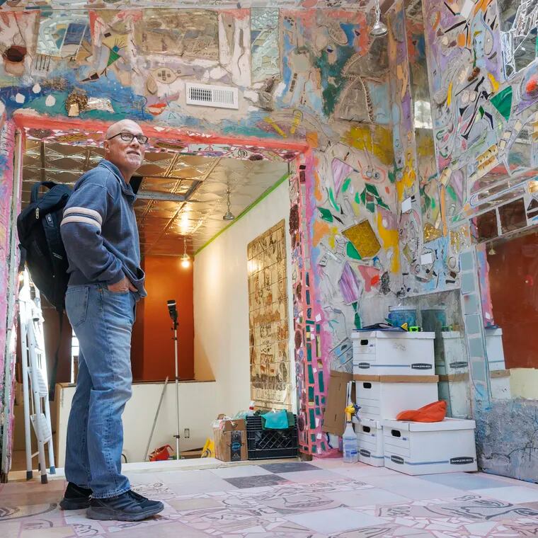Ken Silver of Jim’s Steaks in a room filled with mosaic works mainly by Philadelphia artist Isaiah Zagar.