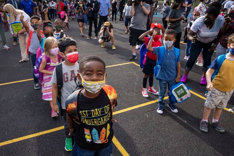 Kindergarteners wait to start their first day of school at Powel SLAMS in Philadelphia on Aug. 31.