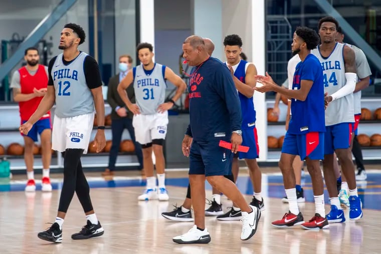 Sixers head coach, Doc Rivers, center, is photographed during the first day of training camp practice at the Seventy Sixers Practice Facility in Camden, N.J.