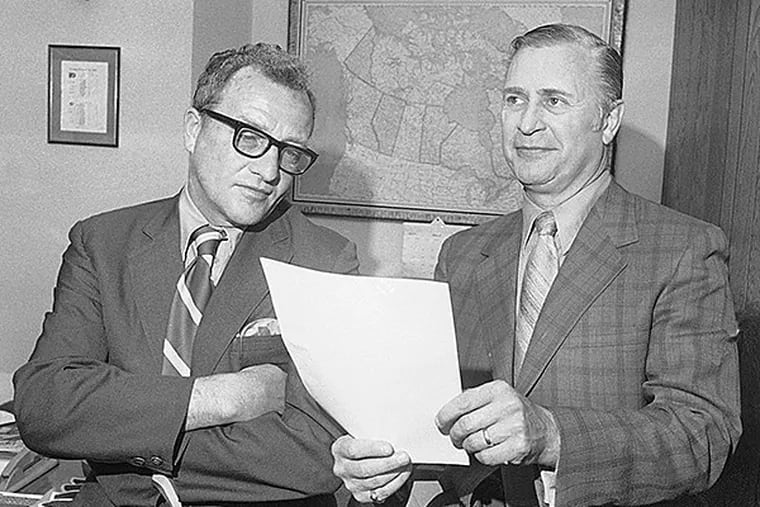 Fred Shero and Keith Allen discussing Shero’s philosophy of coaching. (AP Photo)