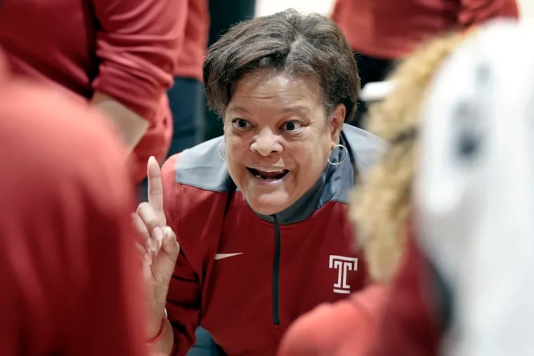 Temple women's basketball coach Diane Richardson huddling with the Owls during a game against at St. Joseph’s on Nov. 23.