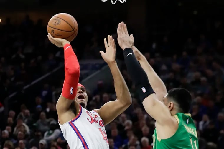 Sixers forward Tobias Harris shoots the basketball over Boston Celtics center Enes Kanter during the first-quarter on Thursday, January 9, 2020 in Philadelphia.