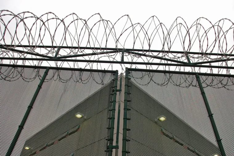 Behind the fence and the razor coil wire on top is the Curran-Fromhold Correctional Facility on State Road in Philadelphia. (Clem Murray/Inquirer) EDITOR’S NOTE: RaceCop17-l 12/11/2007 Investigative series by Mark Fazlollah. 1 of 3