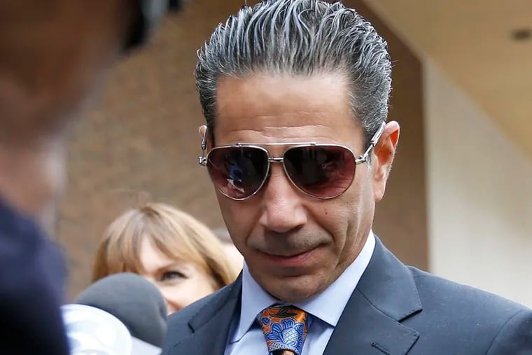 Joey Merlino leaves federal court on Friday, October 10, 2014, after appearing in court on government allegations that he knowingly associated with mobster John Ciancaglini and two othe's with fraud convictions.  ( YONG KIM / Staff Photographer )