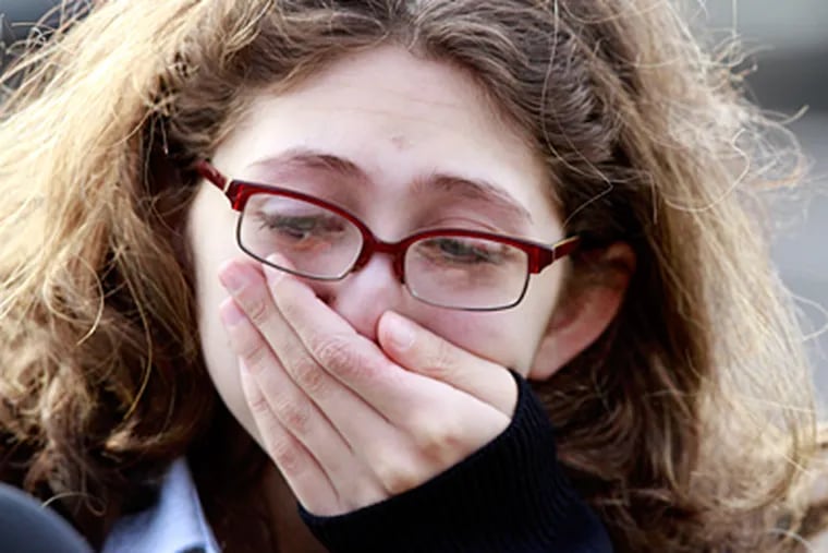 Jessica Barbalalaci, 17, a junior from Morrisville, reacts to the news that Conwell Egan High School will be closed. (David Swanson / Staff Photographer)
