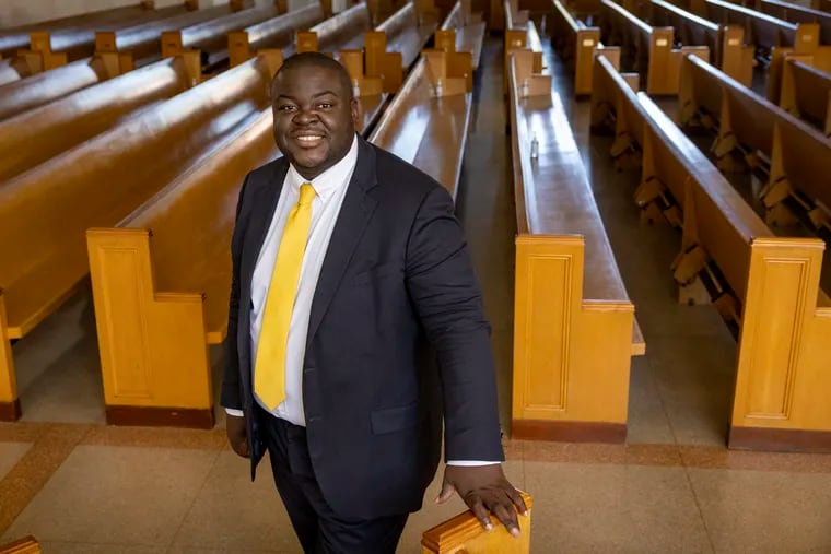 Anthony Phillips stands inside Salem Baptist Church in Abington, where he worships. Phillips won a seat on Philadelphia City Council and will replace Cherelle Parker, who resigned to run for mayor.