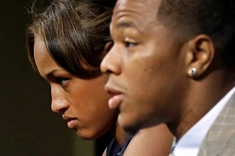 In this May 23, 2014, file photo, Janay Rice, left, looks on as her husband, Baltimore Ravens running back Ray Rice, speaks to the media during a news conference in Owings Mills, Md. A new video that appears to show Ray Rice striking then-fiance Janay Palmer in an elevator last February has been released on a website. (AP Photo/Patrick Semansky, File)