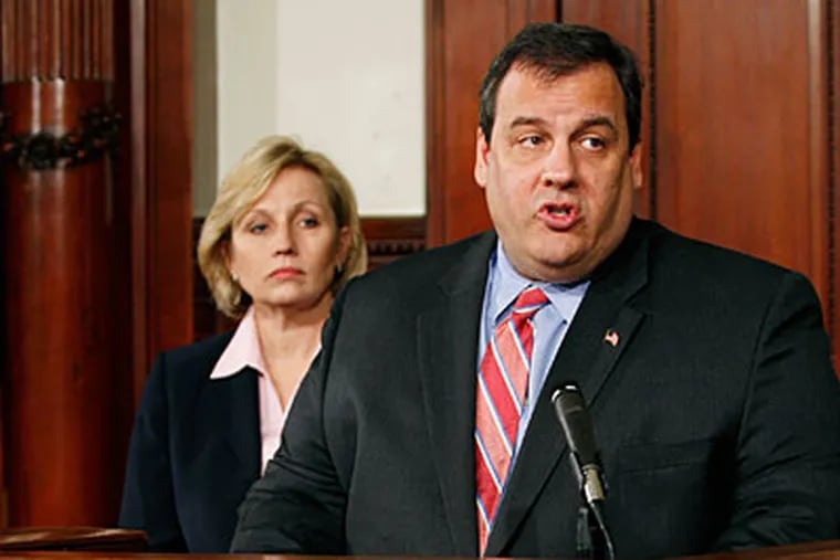 Lt. Gov. Kim Guadagno looks on as Republican New Jersey Gov. Chris Christie answers a question after he signed an executive order Tuesday, Feb. 23, 2010, in Trenton, N.J., that bans state agencies from hiring lobbyists to lobby the state .  (AP Photo/Mel Evans)