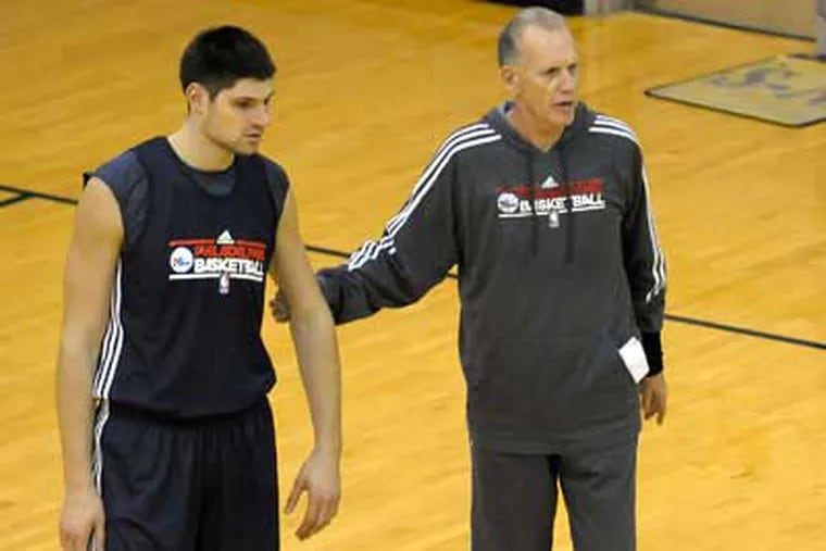 "I believe in him, our guys believe in him," Sixers coach Doug Collins said of Nikola Vucevic. (Michael Perez/AP)