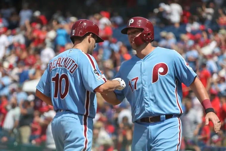 Phillies first baseman Rhys Hoskins, right, avoided an arbitration hearing by agreeing to a $4.8 million salary for 2021. Will catcher J.T. Realmuto return next year, too?