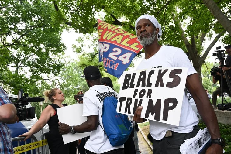 Members of Blacks for Trump gather outside the E. Barrett Prettyman Federal Courthouse in Washington on Aug. 3.