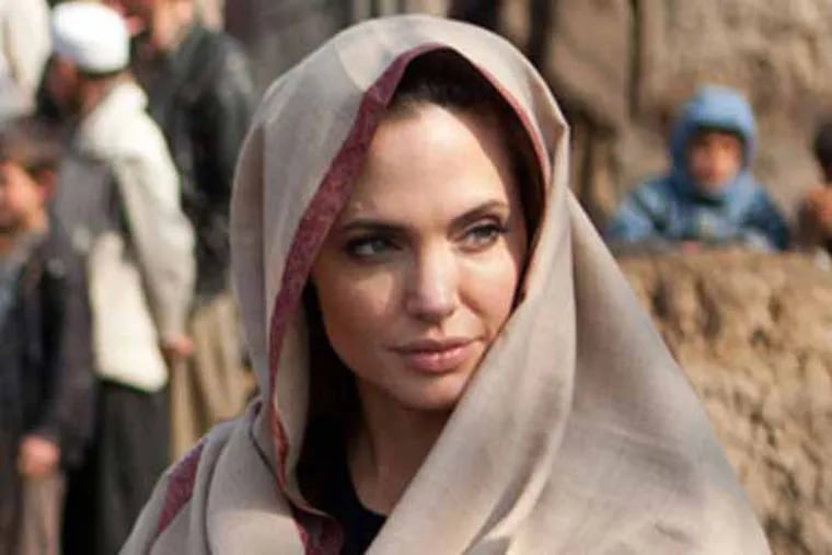 In this image released by the United Nations High Commissioner for Refugees (UNHCR), goodwill ambassador Angelina Jolie meets with village elders upon arrival in Qala Gudar village, Qarabagh District, outside Kabul, Afghanistan, on Tuesday, March 1, 2011, where she will fund a new girls' primary school. (UNHCR, Jason Tanner)
