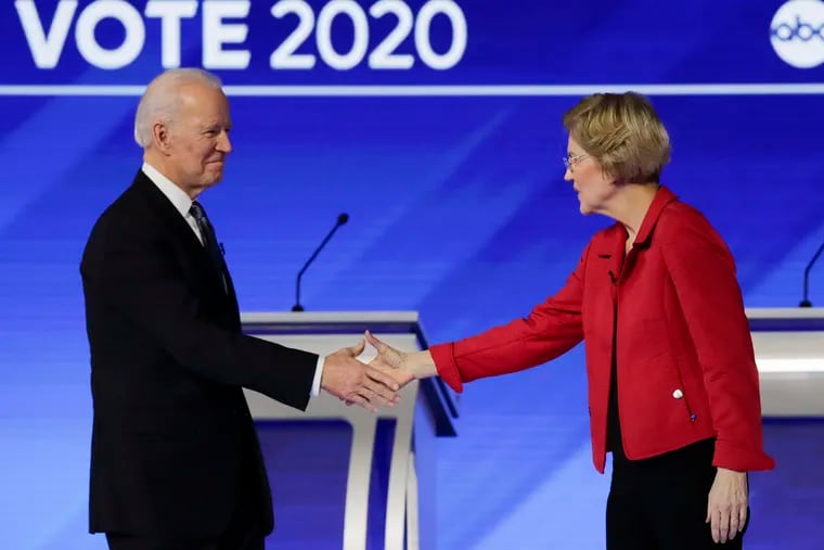 Joe Biden (left) and Elizabeth Warren, shaking hands before a February debate.