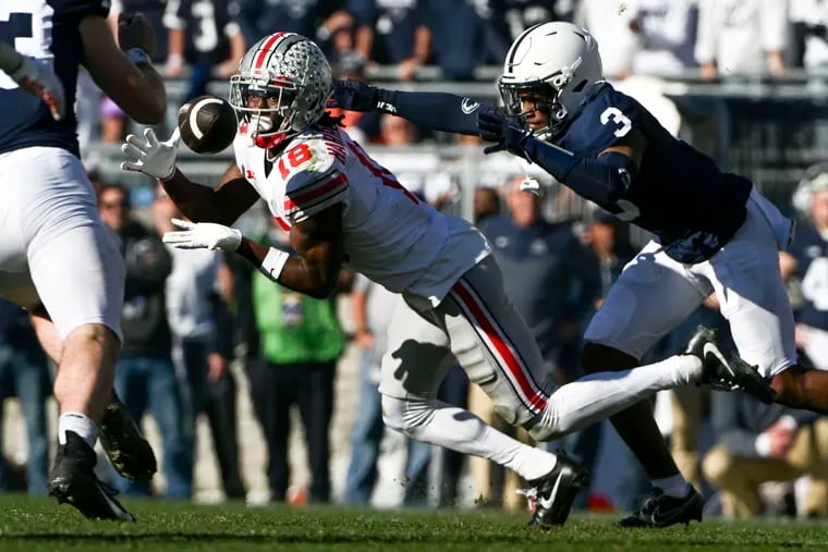 Ohio State wide receiver Marvin Harrison Jr., a former St. Joseph's Prep star,  makes a catch in front of Penn State cornerback Johnny Dixon on Saturday.