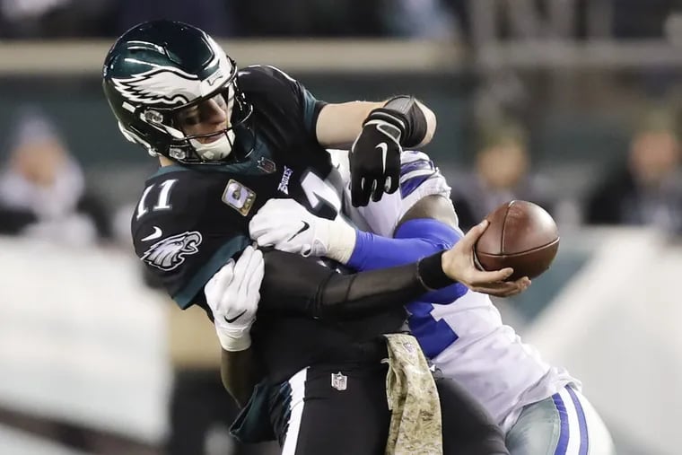 Philadelphia Eagles quarterback Carson Wentz was sacked by Dallas Cowboys defensive end Randy Gregory on this play during the first quarter.