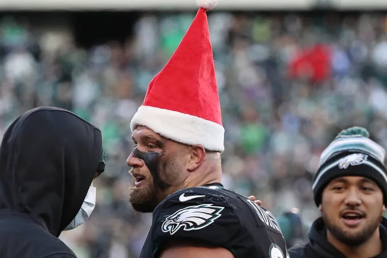Eagles offensive tackle Lane Johnson wears a Santa hat after he scored a touchdown in the fourth quarter of the Birds' 34-10 win over the New York Giants at Lincoln Financial Field on  Dec. 26, 2021.