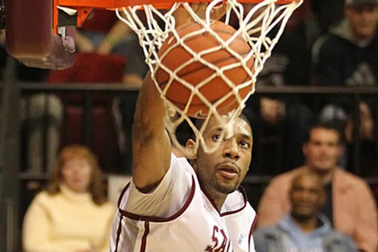 Center C.J. Aiken led the Hawks with a career-high 20 points against Coppin State. (Charles Fox / Staff Photographer)