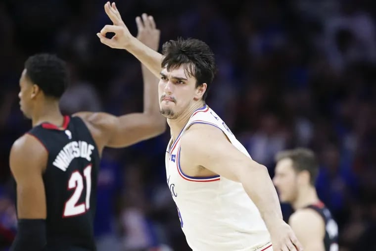 Sixers forward Dario Saric celebrates after making a third-quarter three-pointer in the Sixers’ win over the Heat on Saturday.