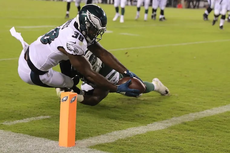 Eagles' running back Matt Jones extends for the goal line to put the Eagles ahead of the Jets on Thursday.